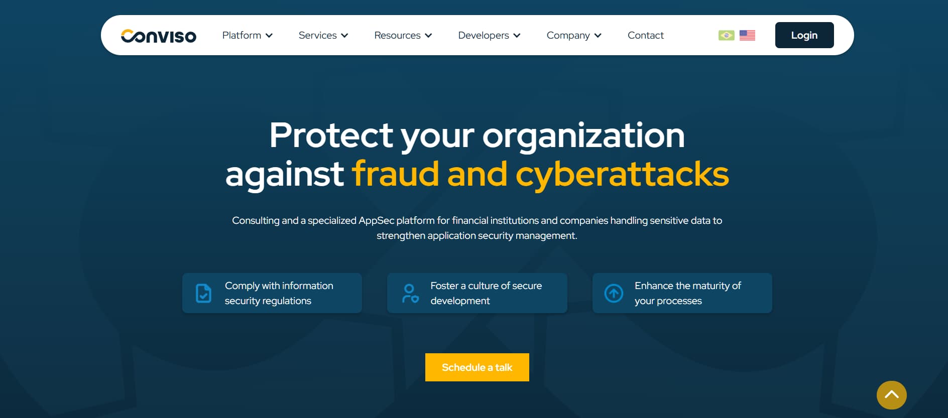 Alt text: Blue-themed cybersecurity website with the headline “Protect your organization against fraud and cyberattacks” and a call-to-action button labeled “Schedule a talk.”