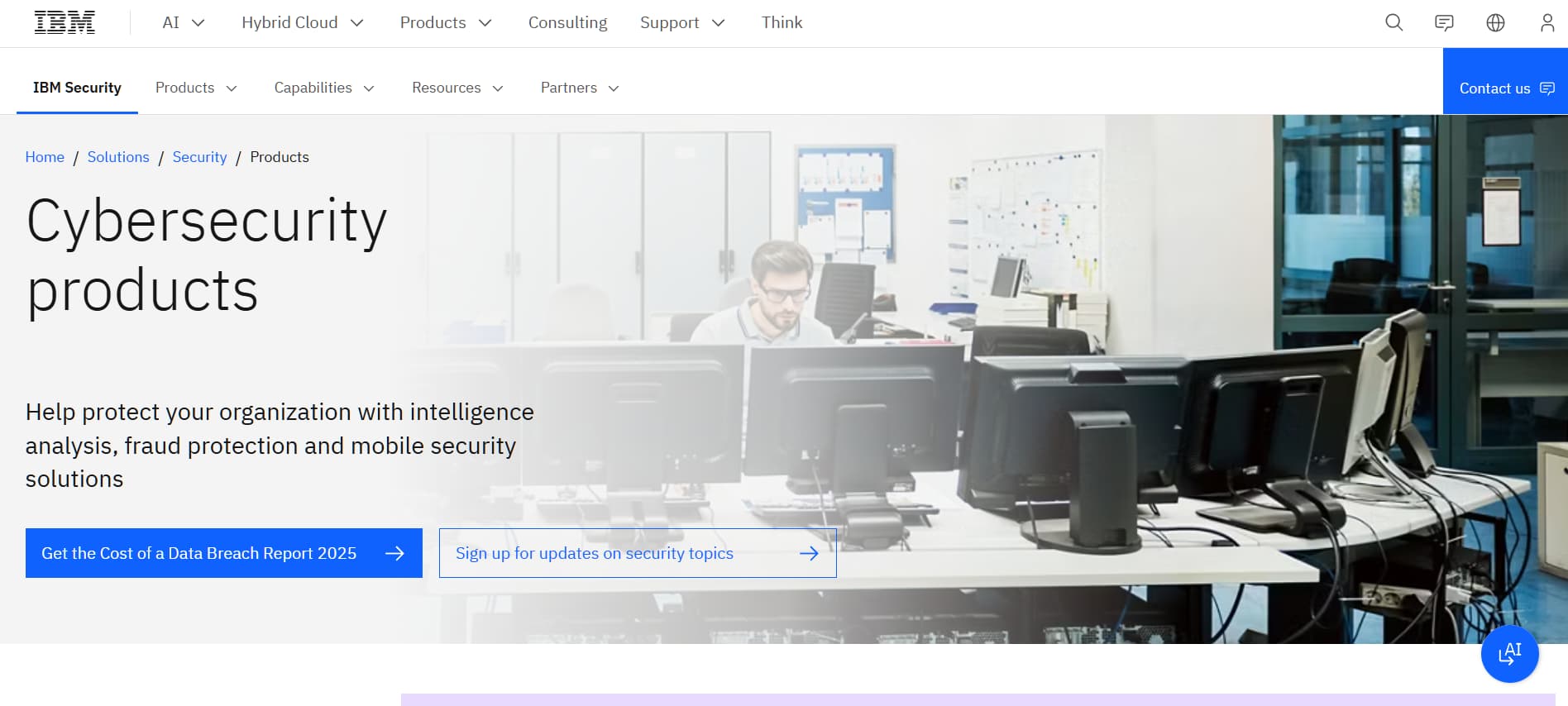 IBM Security products page – “IBM Security webpage showing cybersecurity products with analyst working at computers.”