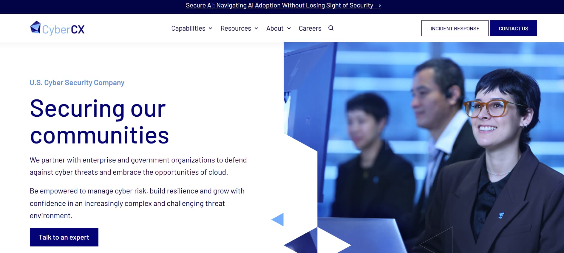“CyberCX website homepage showing cybersecurity professionals in a control room environment, with the headline ‘Securing our communities.’”