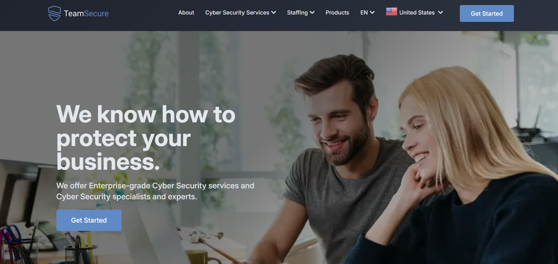 Alt: “TeamSecure enterprise cybersecurity services homepage showing business professionals working on a laptop”