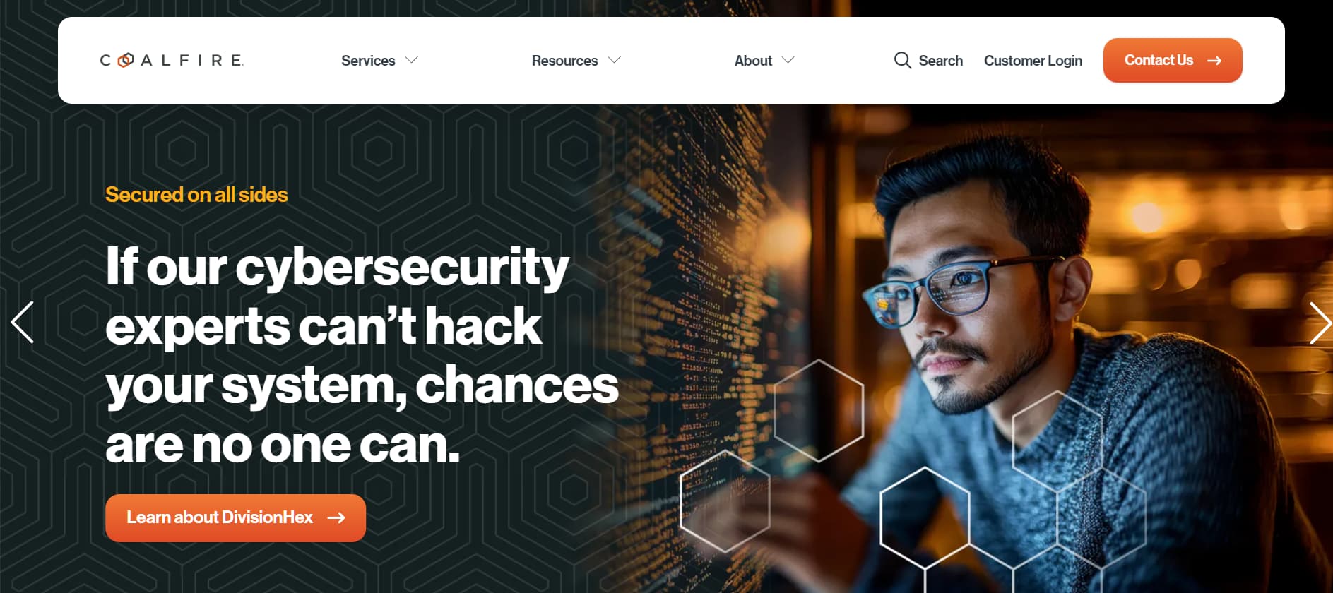 “Coalfire website hero image showing a cybersecurity professional working at a computer with messaging about offensive security testing and system resilience.”