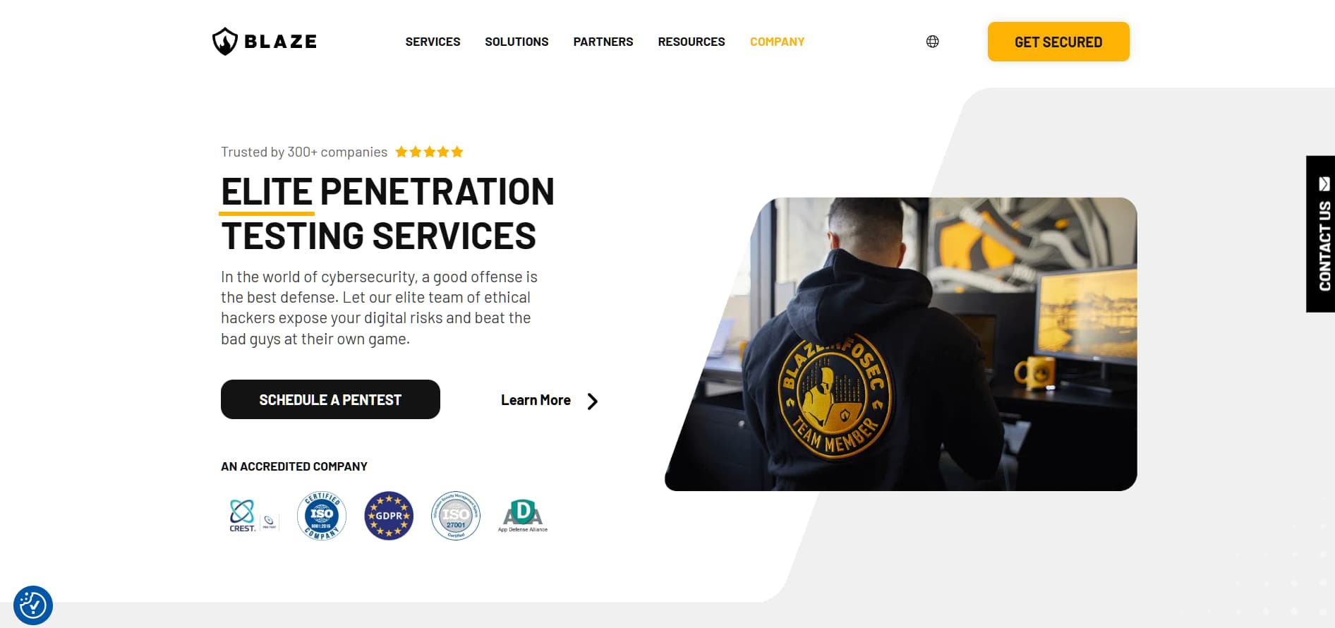 “Blaze cybersecurity homepage promoting elite penetration testing services with ethical hacker at workstation and certification badges.”