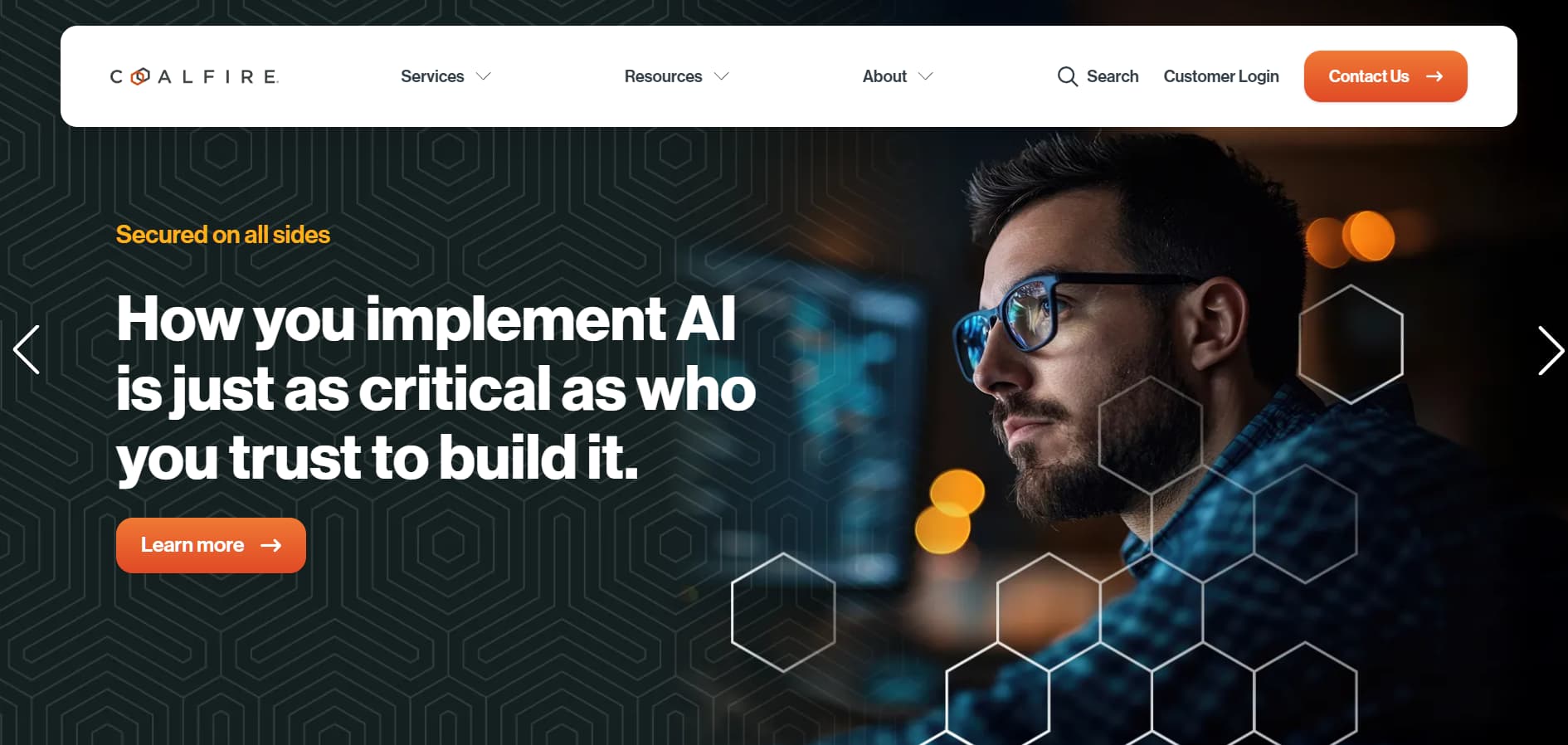“Coalfire website banner with headline about secure AI implementation and a professional working at a computer with hexagonal design overlay.”