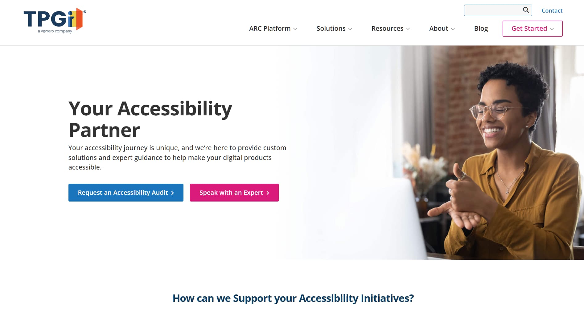 Homepage showing a smiling professional communicating over video call with the headline ‘Your Accessibility Partner’ promoting digital accessibility consulting
