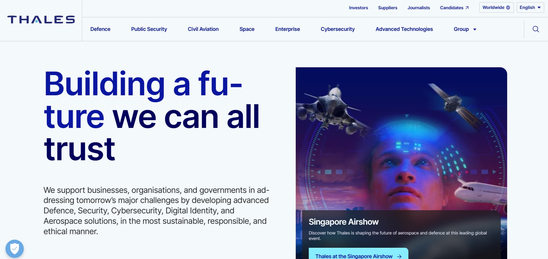 Alt text: Large headline “Building a future we can all trust” beside an image of a person’s face overlaid with digital graphics, a fighter jet, satellite, and airplane representing advanced defense and aerospace technology.