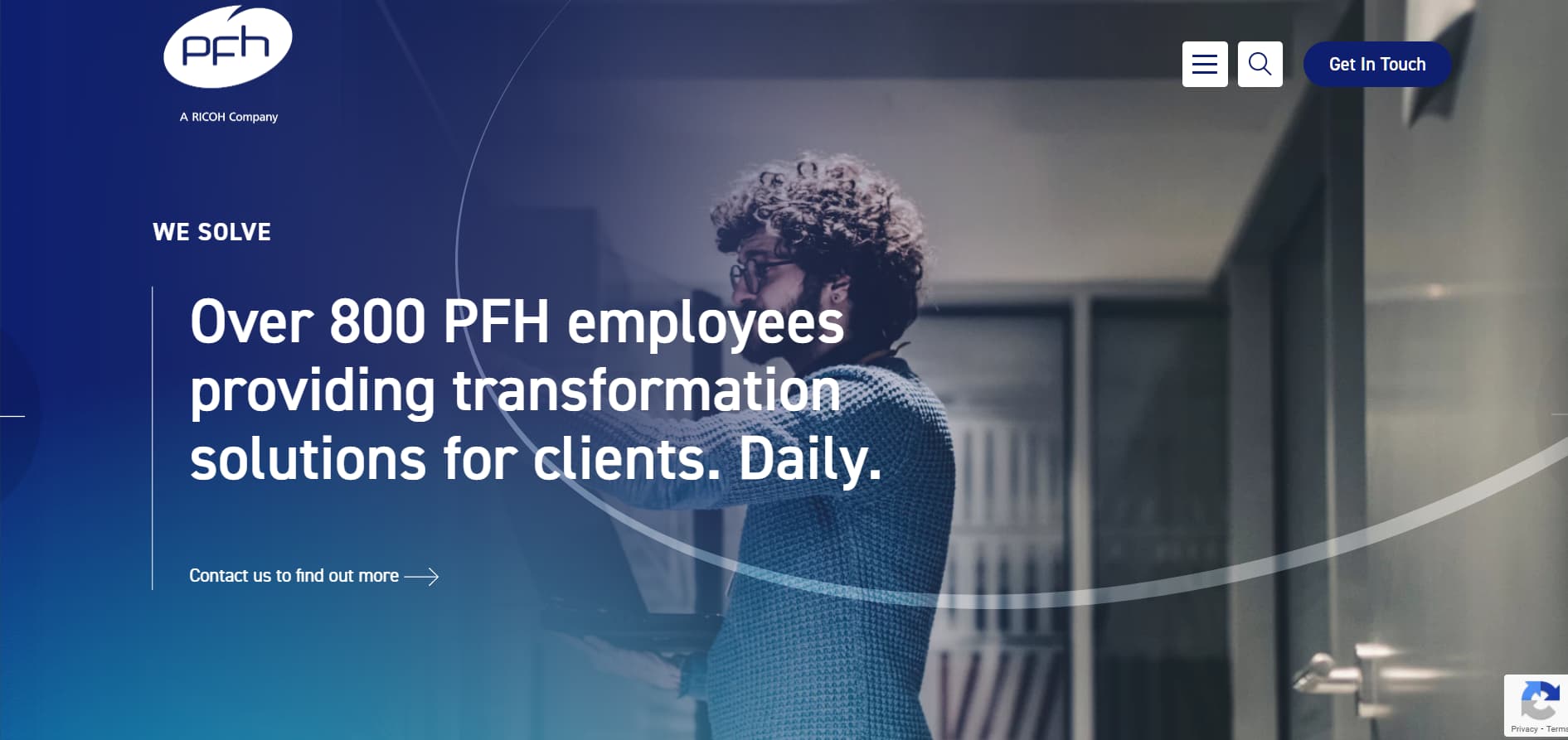 Corporate blue website banner with a man holding a laptop in an office corridor and the headline “Over 800 PFH employees providing transformation solutions for clients. Daily.”