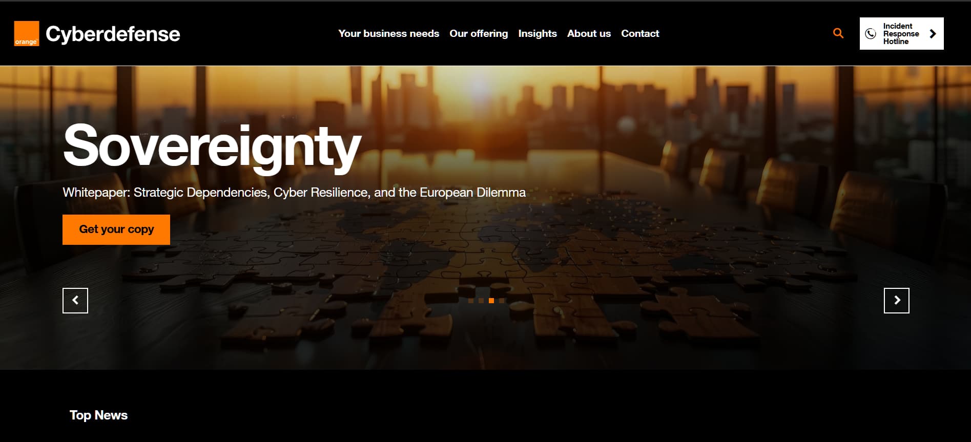 “Orange Cyberdefense website banner showing ‘Sovereignty’ whitepaper promotion over a city skyline and world map puzzle on a conference table at sunset.”